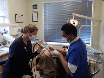 Smile NZ A dentist working on a patient