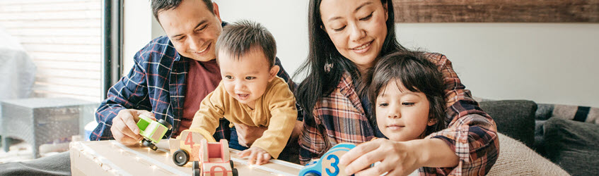 Southern Cross Health Insurance - UltraCare banner A family playing with wooden toy cars