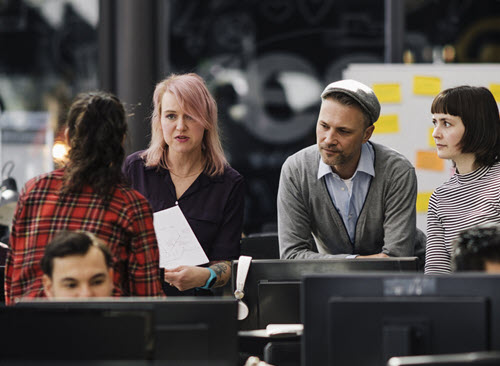 Business continuity Team of people meeting in an office